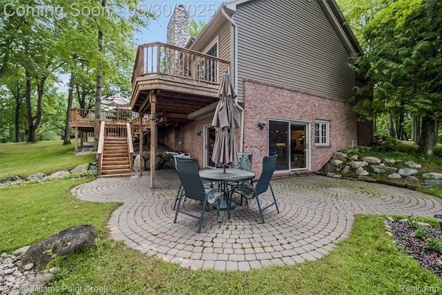3120 Pond Rd, Leonard, MI 48367 - back of property with stairway, a patio, a deck, a yard, and brick siding