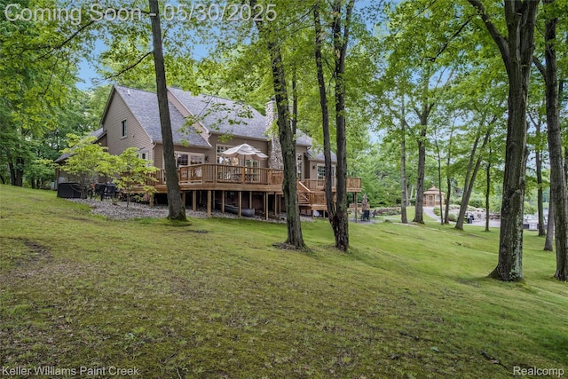 3120 Pond Rd, Leonard, MI 48367 - view of green lawn with a wooden deck