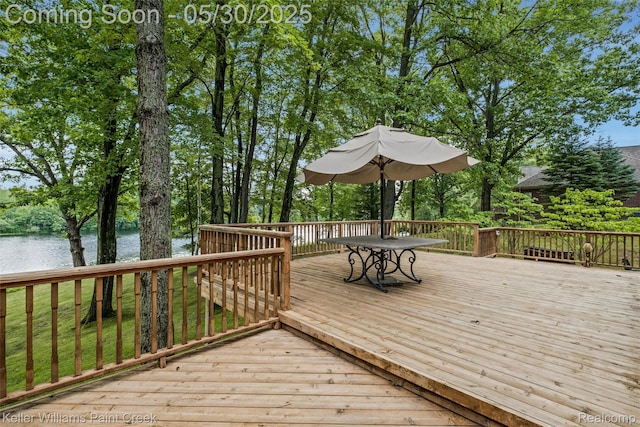 3120 Pond Rd, Leonard, MI 48367 - wooden terrace with a water view