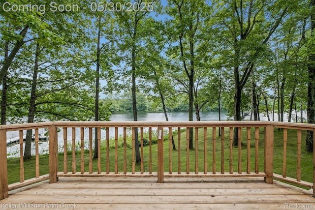 3120 Pond Rd, Leonard, MI 48367 - wooden deck with a water view and a yard