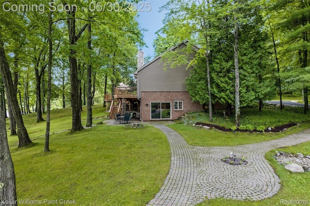 3120 Pond Rd, Leonard, MI 48367 - view of green lawn with stairway, a deck, and a patio
