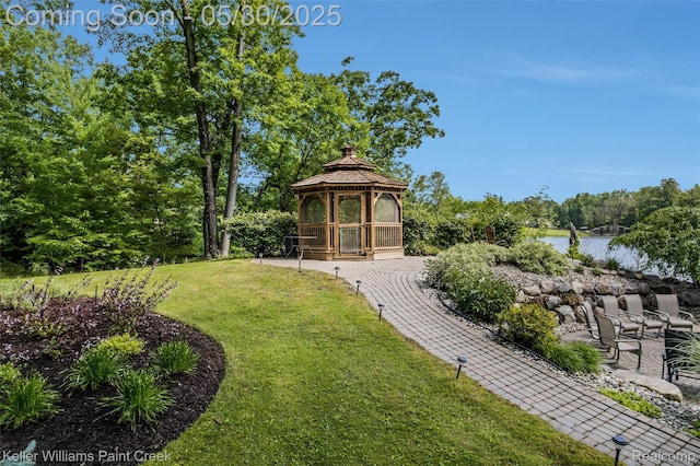 3120 Pond Rd, Leonard, MI 48367 - view of green lawn featuring a gazebo and a water view