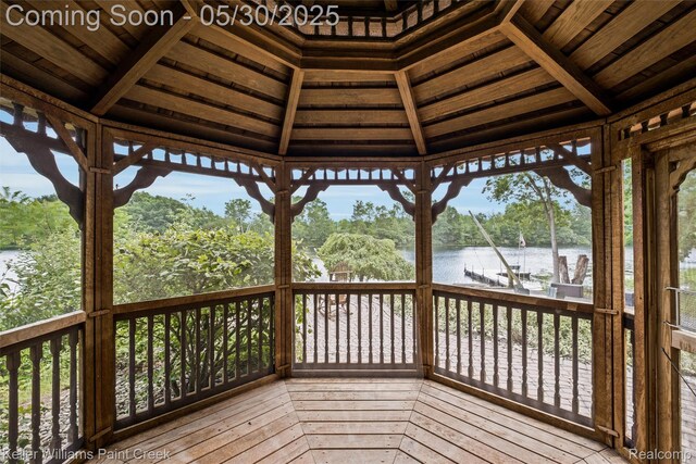 3120 Pond Rd, Leonard, MI 48367 - deck with a water view, view of scattered trees, and a gazebo