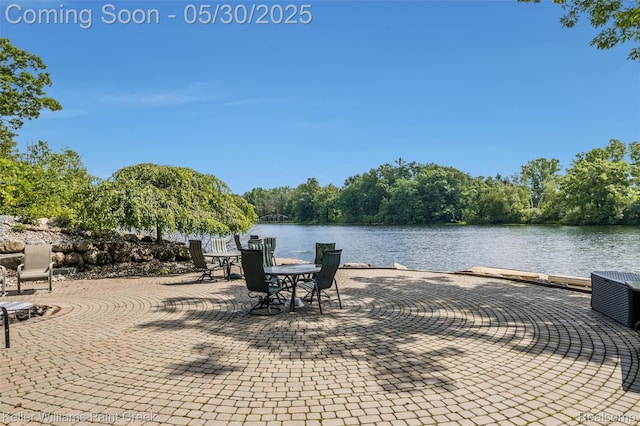 3120 Pond Rd, Leonard, MI 48367 - view of patio featuring a water view, central AC unit, and a forest view