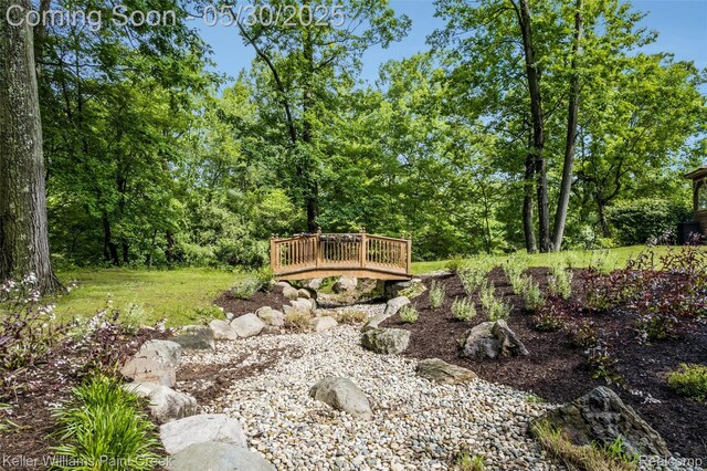 3120 Pond Rd, Leonard, MI 48367 - view of yard featuring a deck