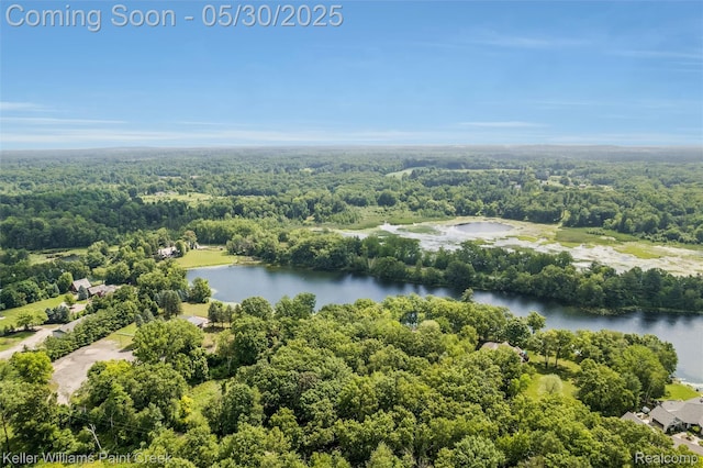 3120 Pond Rd, Leonard, MI 48367 - drone / aerial view of a nearby body of water and a forest