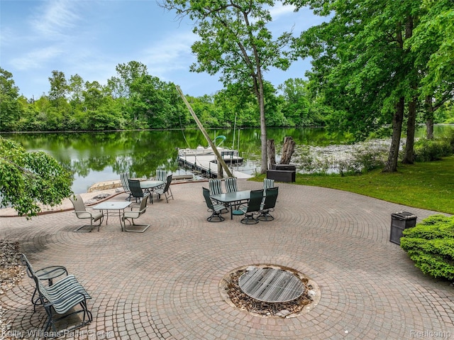 3120 Pond Rd, Leonard, MI 48367 - view of patio / terrace with a water view and a boat dock