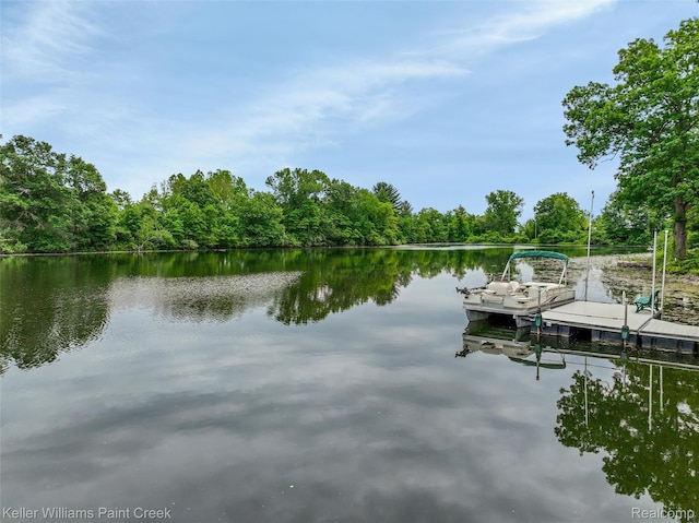 3120 Pond Rd, Leonard, MI 48367 - dock featuring a water view