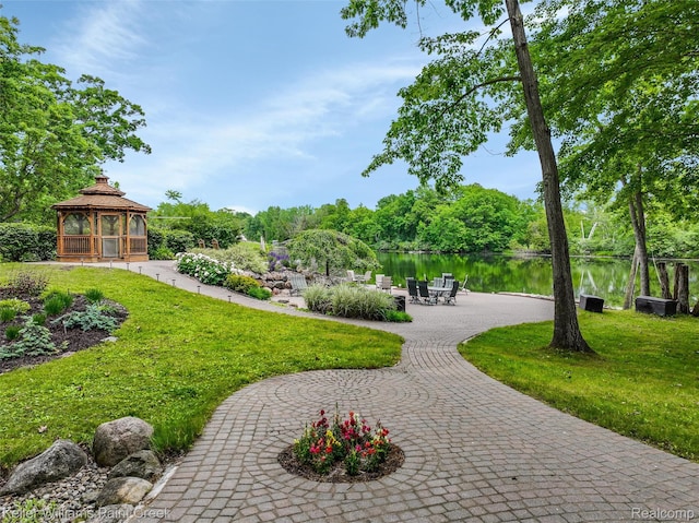 3120 Pond Rd, Leonard, MI 48367 - surrounding community featuring a gazebo, a water view, and a lawn