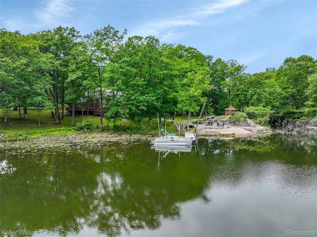 3120 Pond Rd, Leonard, MI 48367 - dock area featuring a water view