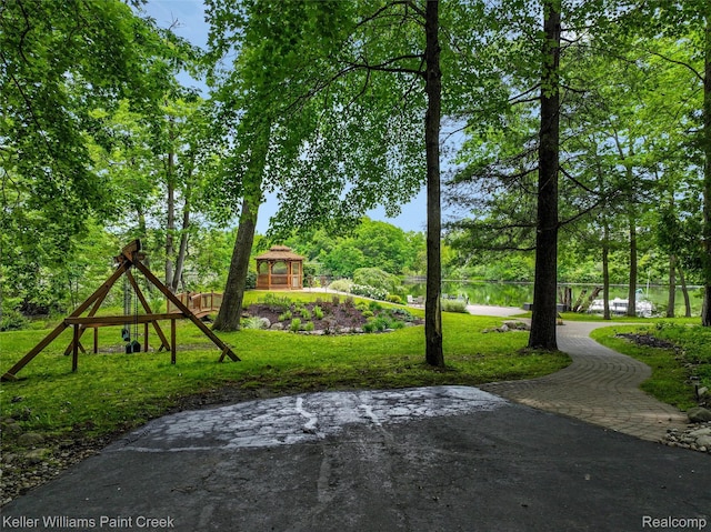 3120 Pond Rd, Leonard, MI 48367 - view of property's community with a gazebo and a water view
