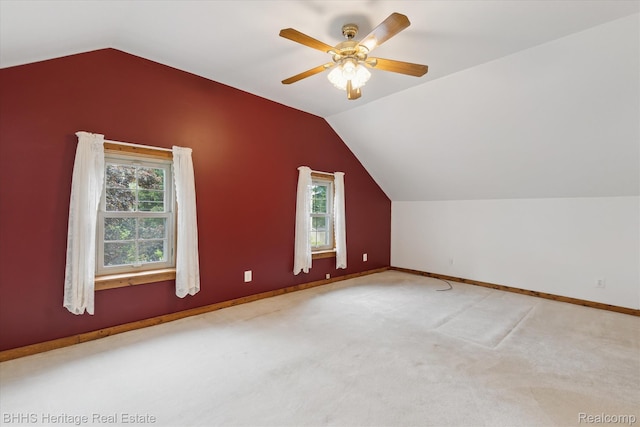 301 N Church St, Byron, MI 48418 - additional living space featuring vaulted ceiling, healthy amount of natural light, a ceiling fan, baseboards, and carpet floors