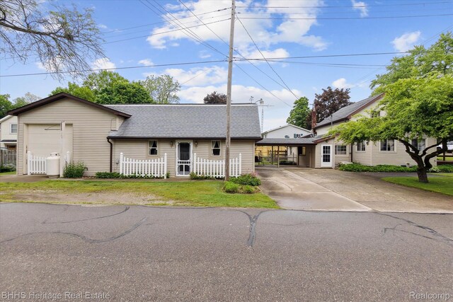 301 N Church St, Byron, MI 48418 - view of front of house with roof with shingles and concrete driveway
