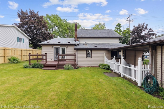 301 N Church St, Byron, MI 48418 - back of house with a wooden deck and a chimney