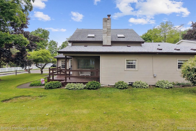 301 N Church St, Byron, MI 48418 - rear view of house with a wooden deck, a chimney, and roof with shingles
