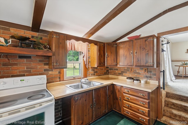 301 N Church St, Byron, MI 48418 - kitchen featuring white electric stove, a sink, light countertops, and tasteful backsplash