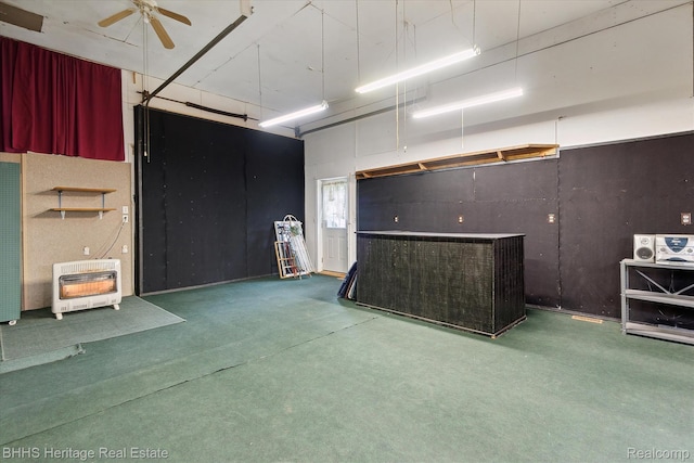 301 N Church St, Byron, MI 48418 - garage with heating unit and a ceiling fan