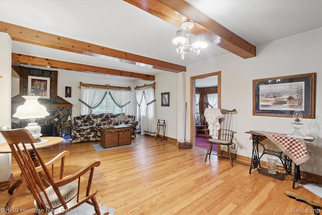 301 N Church St, Byron, MI 48418 - living area featuring beamed ceiling, light wood-style flooring, a chandelier, and baseboards