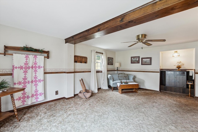 301 N Church St, Byron, MI 48418 - living area with carpet floors, ceiling fan, beamed ceiling, and baseboards