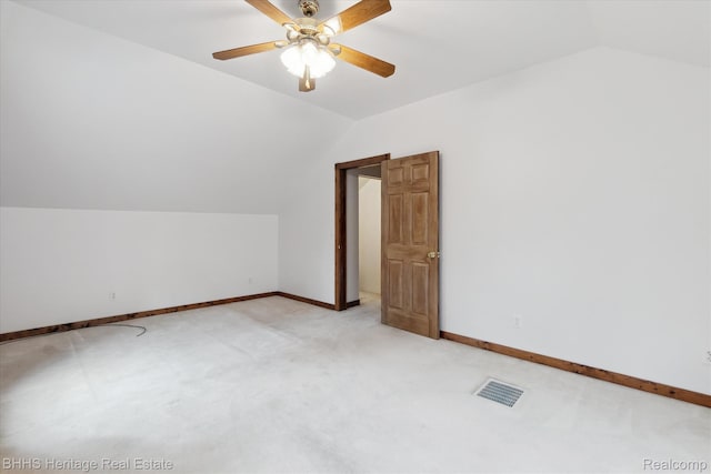 301 N Church St, Byron, MI 48418 - additional living space with lofted ceiling, ceiling fan, baseboards, and light colored carpet