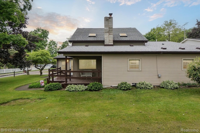 301 N Church St, Byron, MI 48418 - back of house with a wooden deck, a shingled roof, and a chimney