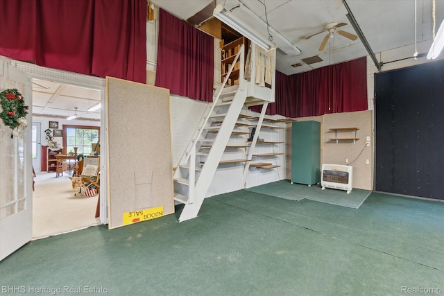 301 N Church St, Byron, MI 48418 - garage featuring heating unit and ceiling fan