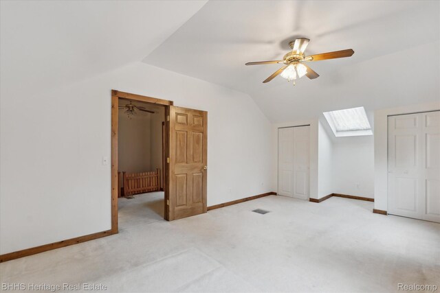 301 N Church St, Byron, MI 48418 - additional living space featuring lofted ceiling, light colored carpet, a ceiling fan, a skylight, and baseboards