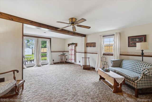 301 N Church St, Byron, MI 48418 - living area with ceiling fan, carpet floors, and beamed ceiling