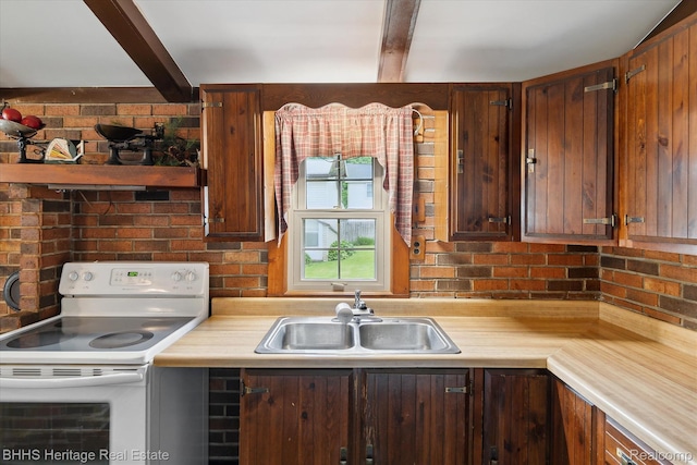 301 N Church St, Byron, MI 48418 - kitchen with white range with electric stovetop, a sink, light countertops, and beamed ceiling