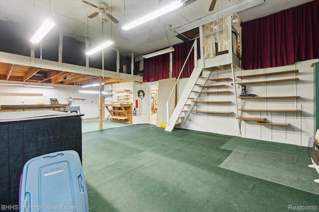 301 N Church St, Byron, MI 48418 - below grade area featuring ceiling fan, stairs, and carpet floors