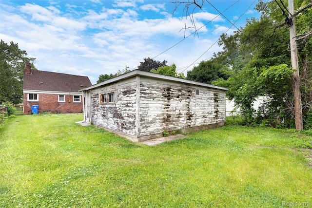 1621 Fairbairn St, Dearborn, MI 48141 - view of home's exterior featuring a lawn, a chimney, and brick siding