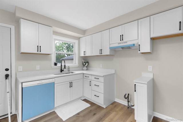 1621 Fairbairn St, Dearborn, MI 48141 - kitchen with dishwashing machine, under cabinet range hood, white cabinets, light wood-style floors, and light countertops