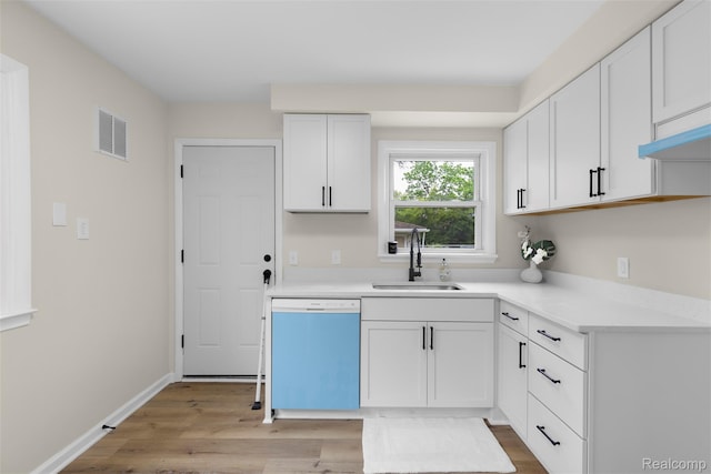 1621 Fairbairn St, Dearborn, MI 48141 - kitchen with dishwasher, light wood-style floors, light countertops, and white cabinetry