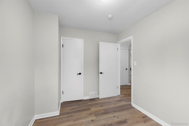 1621 Fairbairn St, Dearborn, MI 48141 - unfurnished bedroom with baseboards and wood finished floors