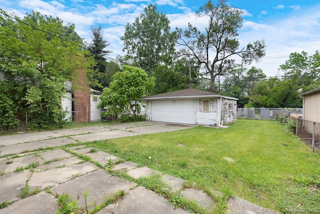 1621 Fairbairn St, Dearborn, MI 48141 - view of yard featuring a garage and an outbuilding