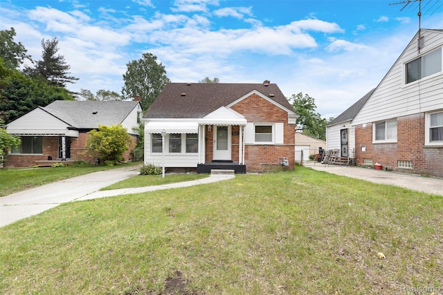 1621 Fairbairn St, Dearborn, MI 48141 - bungalow-style home with entry steps, a front lawn, and brick siding