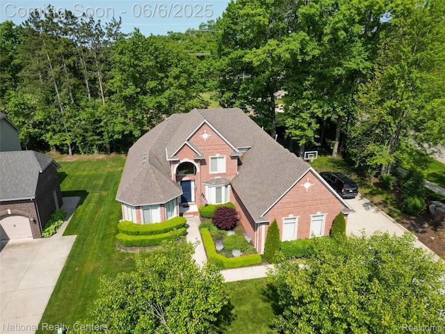 54959 Glen Oaks Dr, Shelby Twp, MI 48315 - view of front of house with brick siding, a front yard, and a shingled roof