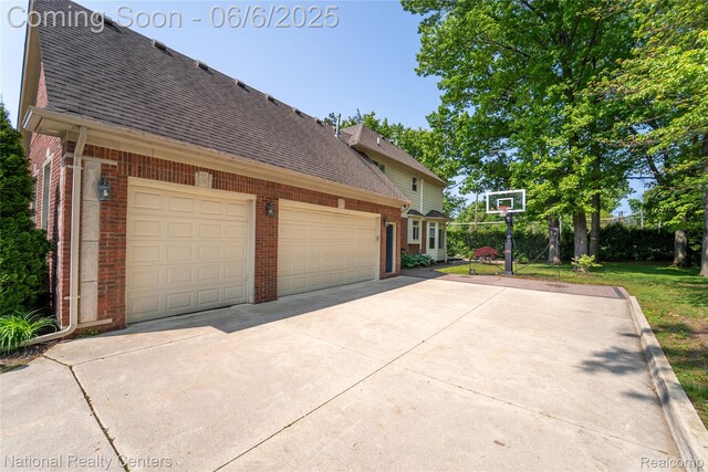 54959 Glen Oaks Dr, Shelby Twp, MI 48315 - view of property exterior with brick siding, roof with shingles, concrete driveway, and an attached garage