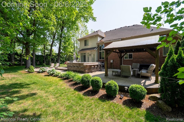 54959 Glen Oaks Dr, Shelby Twp, MI 48315 - back of house with brick siding, a gazebo, a yard, a patio area, and an outdoor hangout area
