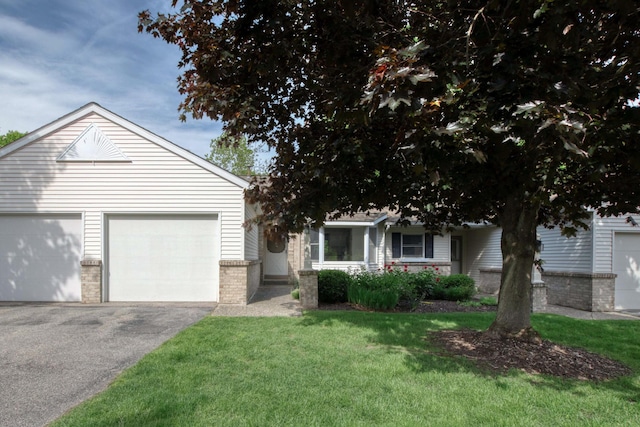 81 Skyline Cir NW, Grand Rapids, MI 49504 - view of front of home featuring driveway, a front yard, and brick siding