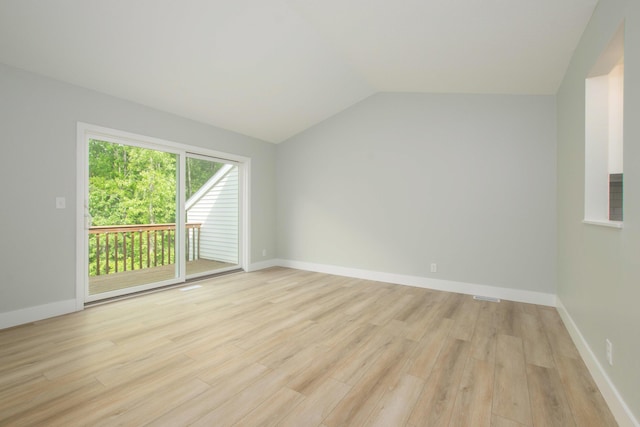 81 Skyline Cir NW, Grand Rapids, MI 49504 - spare room featuring light wood-style flooring, vaulted ceiling, and baseboards