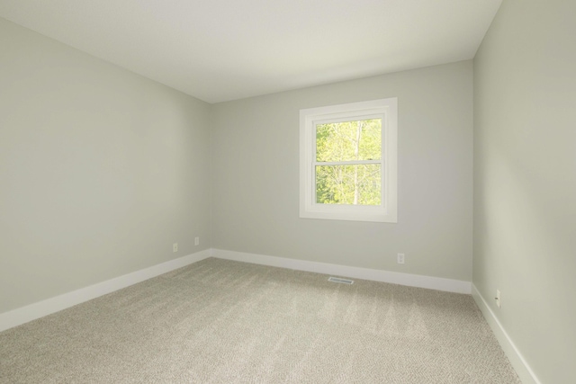 81 Skyline Cir NW, Grand Rapids, MI 49504 - unfurnished room with light colored carpet and baseboards