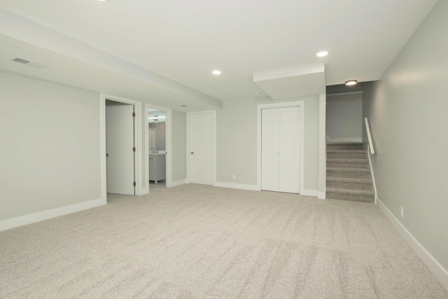 81 Skyline Cir NW, Grand Rapids, MI 49504 - finished basement featuring light colored carpet, stairway, recessed lighting, and baseboards