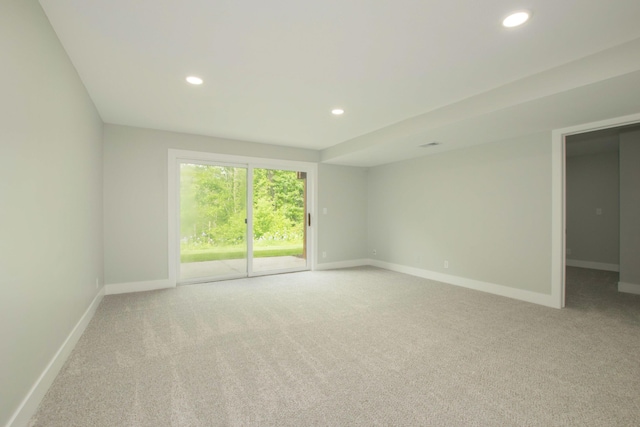 81 Skyline Cir NW, Grand Rapids, MI 49504 - spare room featuring light carpet, baseboards, and recessed lighting