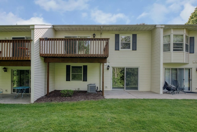 81 Skyline Cir NW, Grand Rapids, MI 49504 - back of house with central AC unit, a yard, and a patio