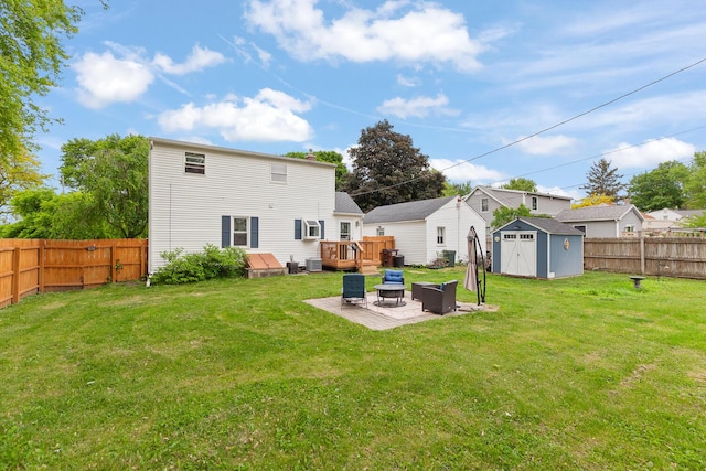 2045 Adams St, Adrian, MI 49221 - back of property featuring a wooden deck, a patio area, a fire pit, and central air condition unit