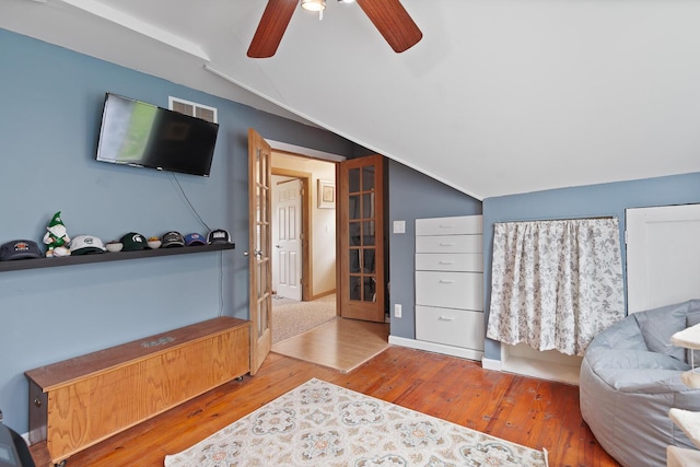 2045 Adams St, Adrian, MI 49221 - bedroom with lofted ceiling, wood finished floors, a ceiling fan, and french doors