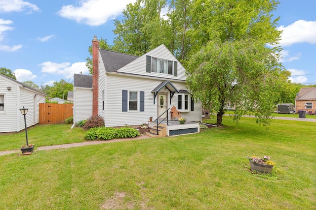 2045 Adams St, Adrian, MI 49221 - view of front of home featuring a chimney and roof with shingles