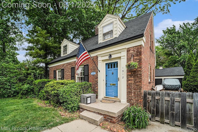 1312 Catalpa Dr, Royal Oak, MI 48067 - cape cod-style house with brick siding and a shingled roof