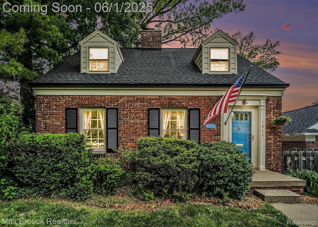 1312 Catalpa Dr, Royal Oak, MI 48067 - new england style home featuring a chimney, a shingled roof, and brick siding
